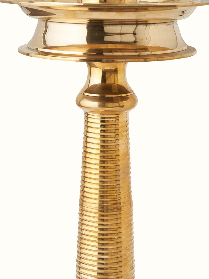 Angled view of Brass-plated Kuthu Vilakku Stand Diya showing the traditional Kuthu Vilakku diya with ornate brass detailing
