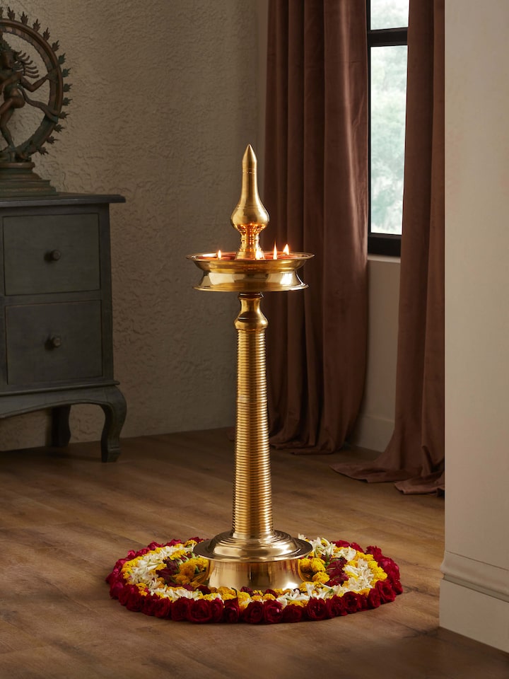 Side view of Brass-plated Kuthu Vilakku Stand Diya showing the intricate craftsmanship and elegant structure
