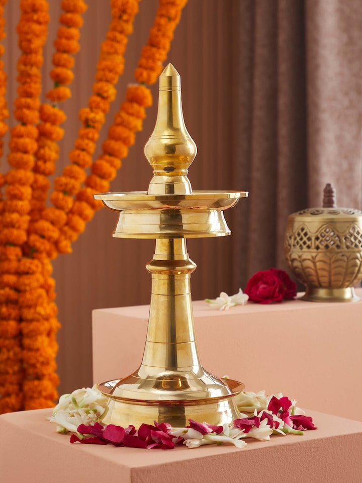 Side view of Traditional brass samai vilakku stand diya showcasing its intricate craftsmanship