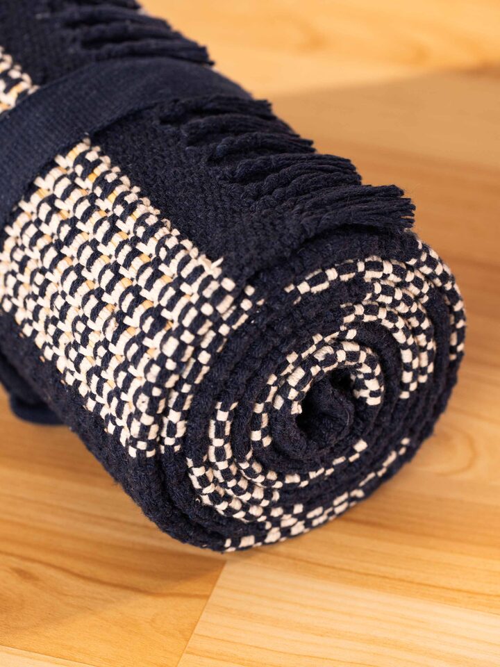 Back view of Indigo Stripe Natural Grass Cotton Yoga Mat showcasing its eco-friendly material and premium design