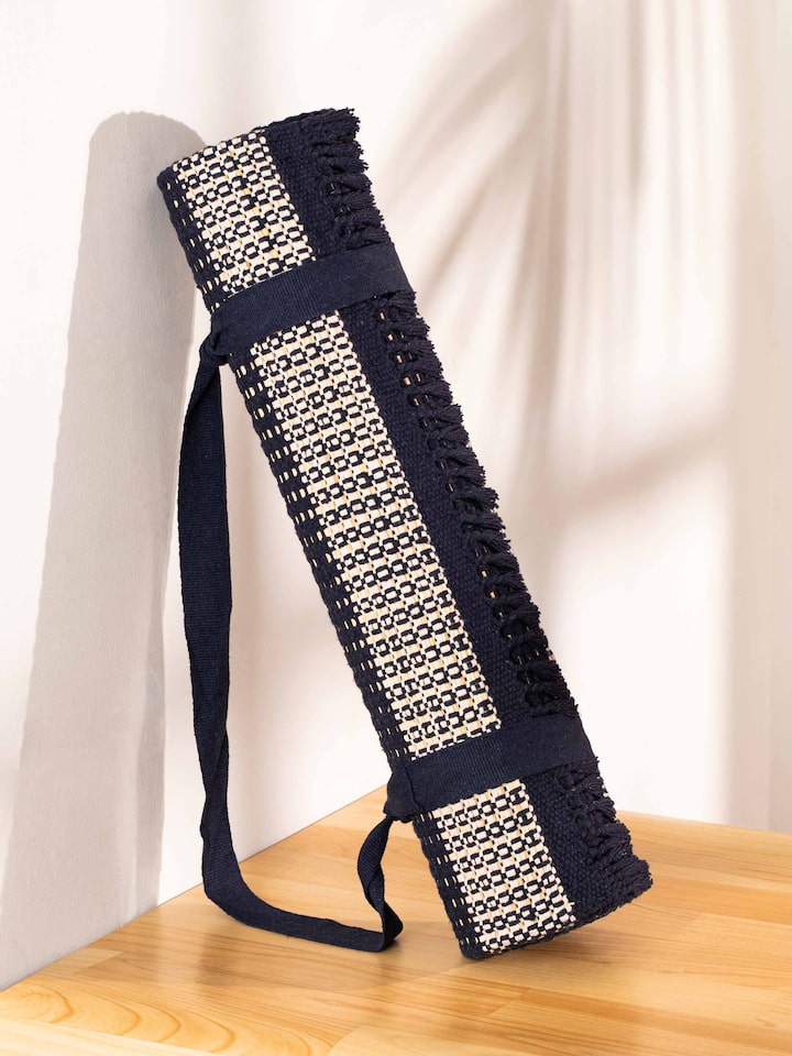 Side view of Indigo Stripe Natural Grass Cotton Yoga Mat showcasing its durable texture and natural design