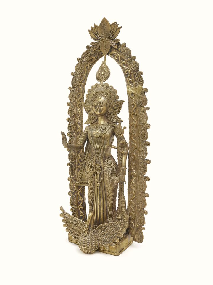 Side view of Dhokra Saraswati Brass Idol displaying detailed craftsmanship and design