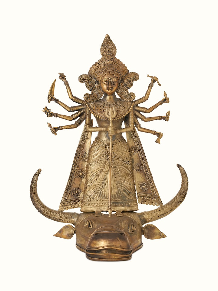 Front view of Brass dhokra Durga on bull idol in golden color displaying detailed craftsmanship and design.