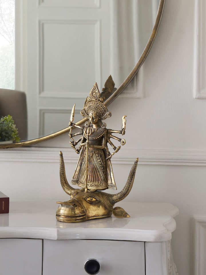 Side view of Brass Dhokra Durga on Bull Idol showing detailed brass work and design.