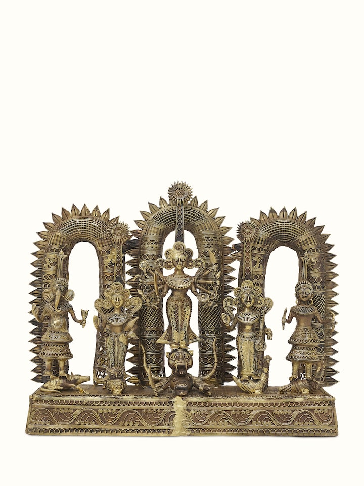Front view of Pristine dhokra brass goddess idol showcasing detailed craftsmanship and traditional design