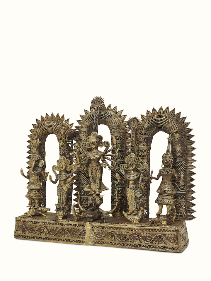 Angled view of Pristine dhokra brass goddess idol highlighting the intricate detailing and elegant posture