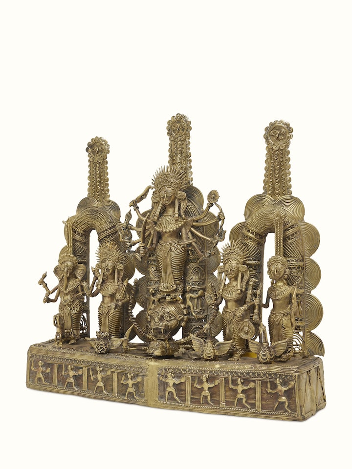 Side view of Beatific Dhokra Brass Creator Goddess Idol emphasizing the elegant brass design and structure