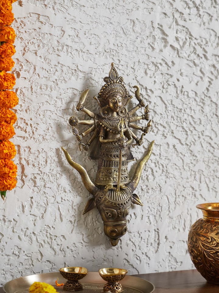 Close-up view of brass Dhokra Durga idol highlighting the intricate craftsmanship and fine detailing