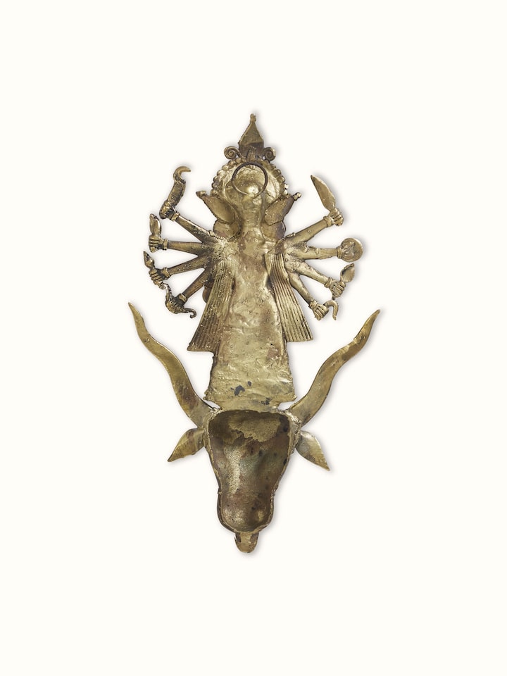 Angled view of brass Dhokra Durga idol emphasizing the depth and artistry of the metalwork