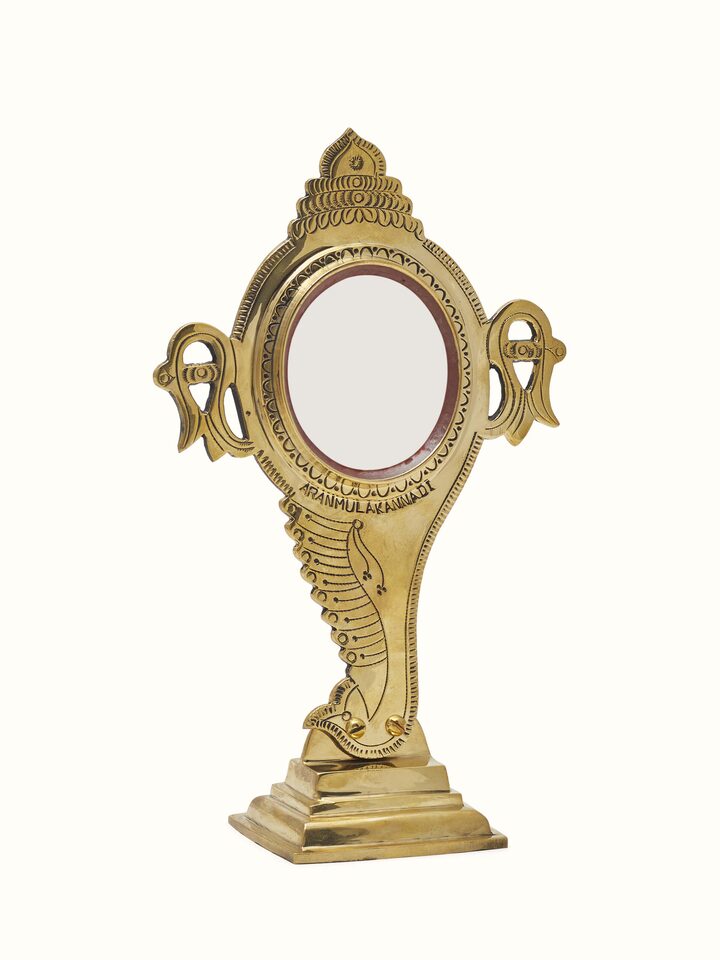 Close-up view of Natural Aranmula Kannadi Brass Mirror highlighting the handcrafted detailing and finish, from a different angle