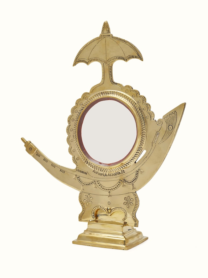 Close-up of Aranmula Kannadi Brass Mirror focusing on the mirror's clarity and frame