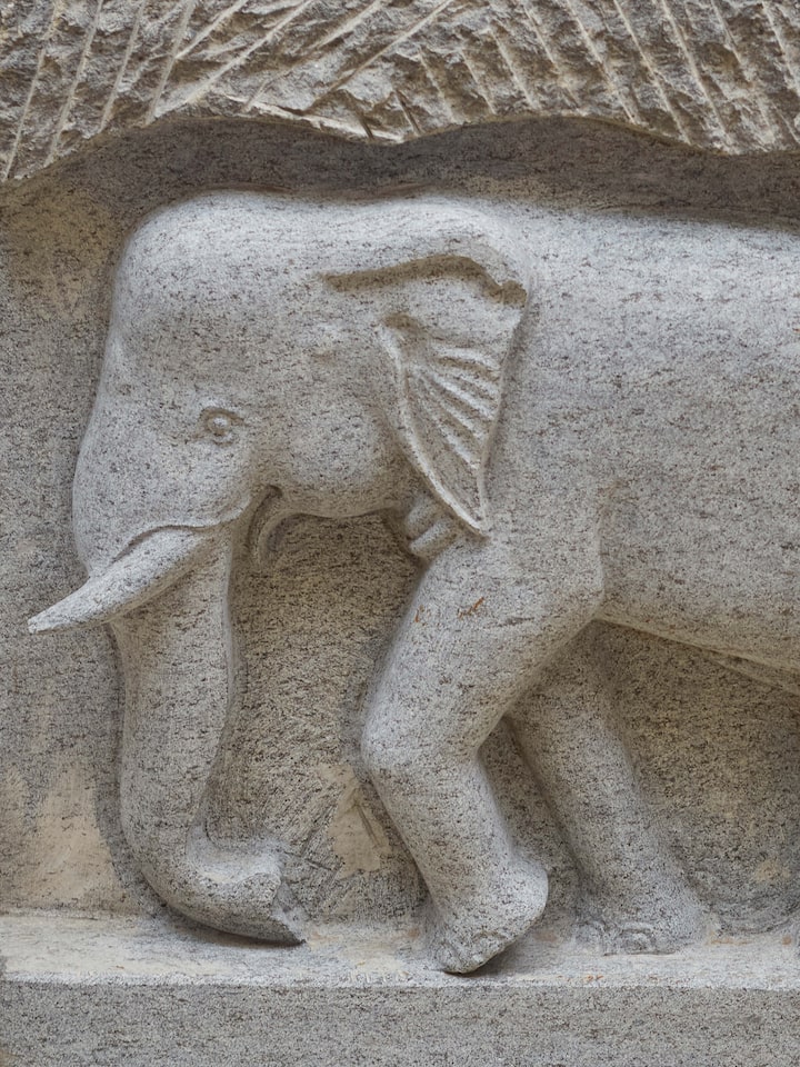 Detailed view of Magnificent carved stone elephant panel sculpture showcasing the detailed elephant motif and craftsmanship