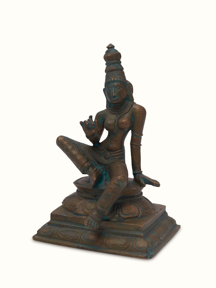 Side view of antique bronze casting boga Sakthi idol, showcasing its detailed craftsmanship