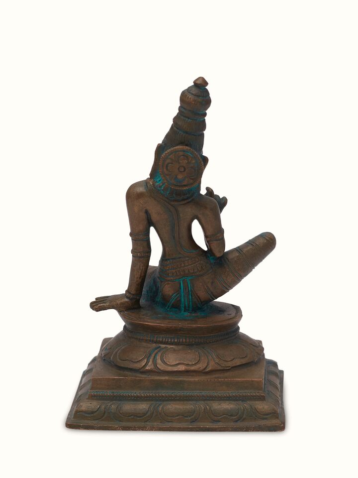 Angled view of antique bronze casting boga Sakthi idol, showcasing its ornate design