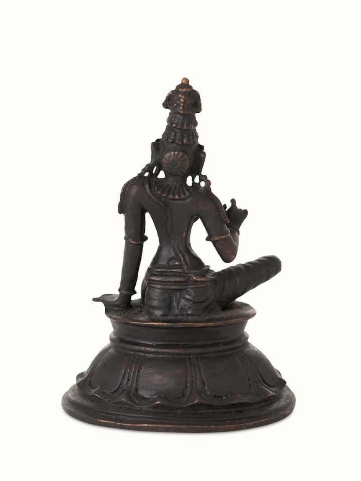 Side view of pristine bronze casting Boga Sakthi idol highlighting intricate details