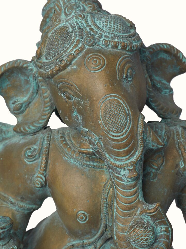 Close-up of Dancing Vinayagar bronze casting idol showing detailed bronze work