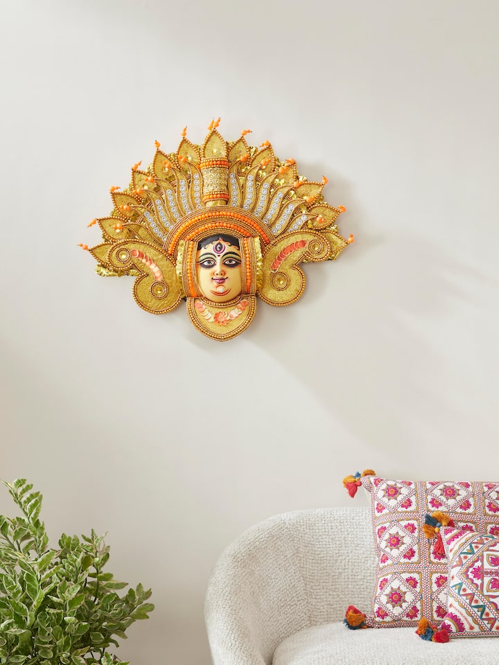 Close-up view of Chhau Devi wall mask made from clay and paper, focusing on its elaborate design.