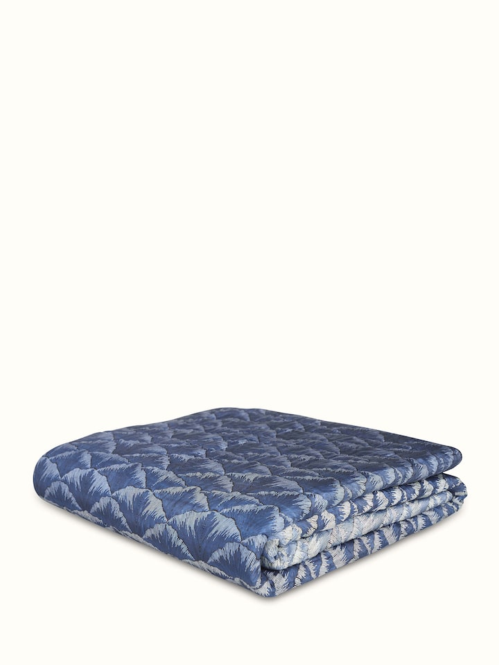 Parvat indigo ombre silk Sanganeri block printed double quilt displayed fully