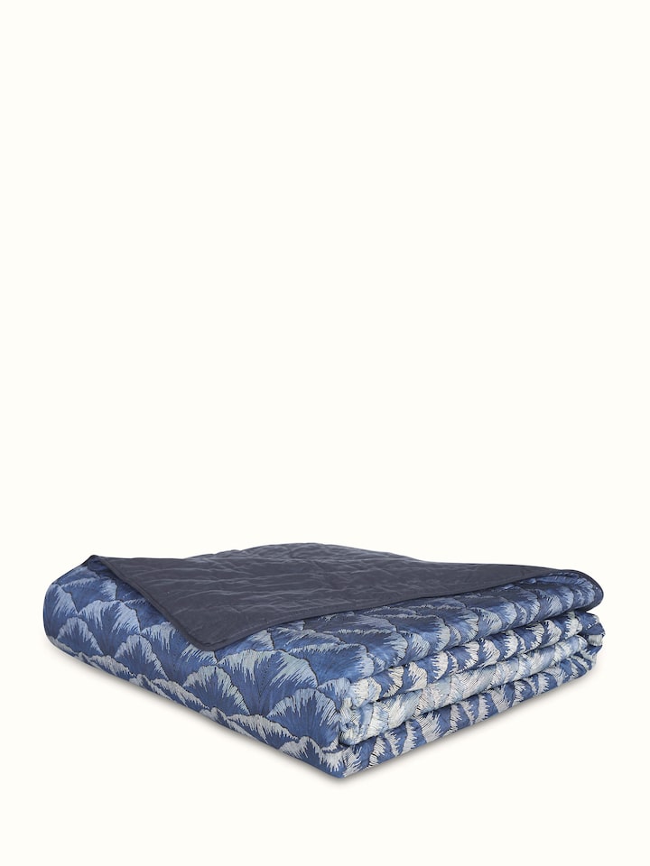 Detailed image showing the ombre effect and block print on the Parvat silk quilt