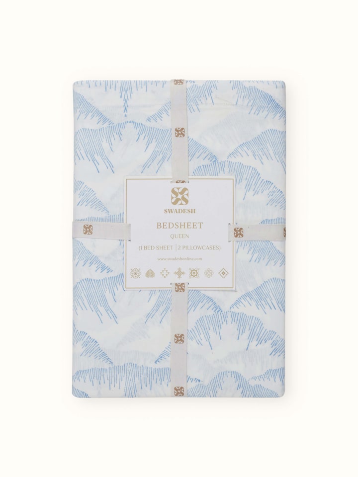 Angled view of Parvat blue textured cotton Sanganeri block printed queen bedsheet set emphasizing the pattern and color