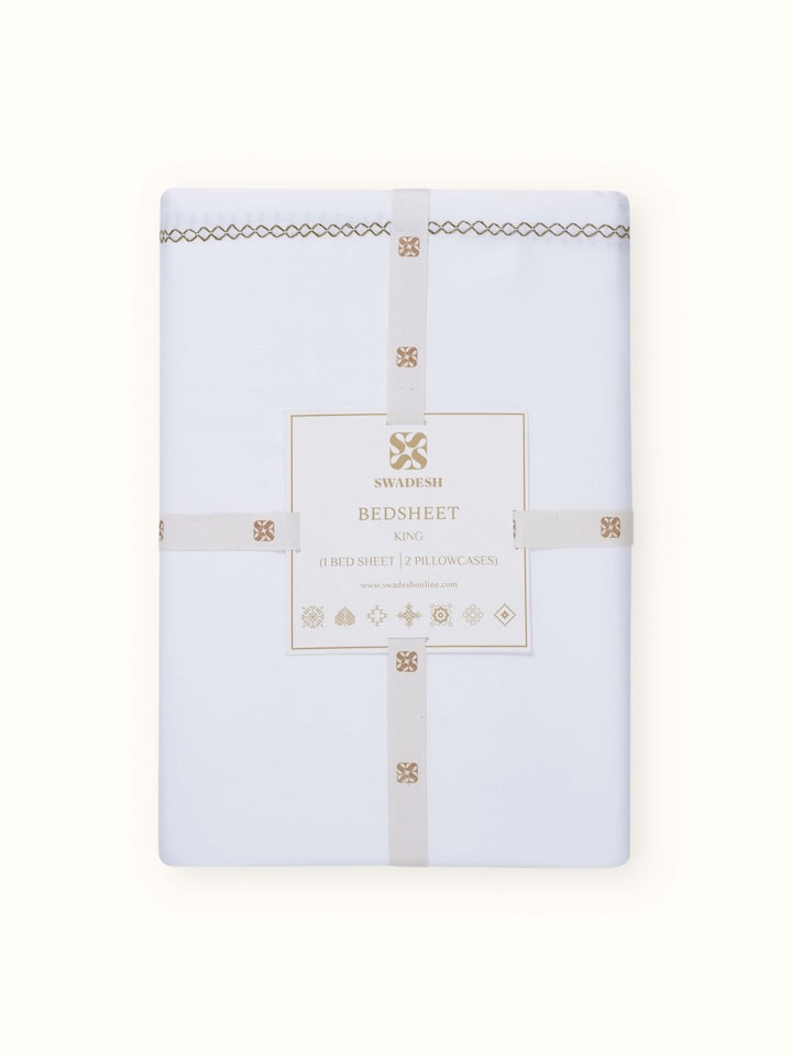 Detailed view of Parvat beige stripe cotton hand embroidered bedsheet king set focusing on the hand-embroidered patterns and stripe texture.