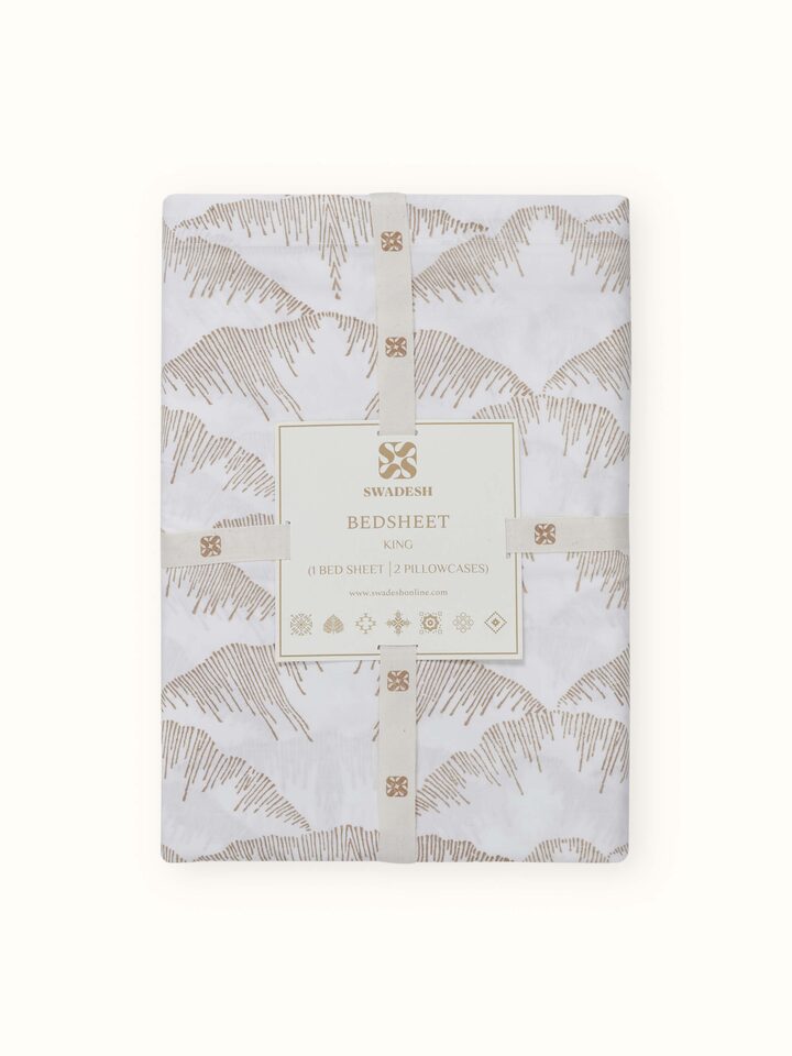 The Parvat beige textured cotton Sanganeri block printed king bedsheet set with accompanying pillow covers, displaying the full set.
