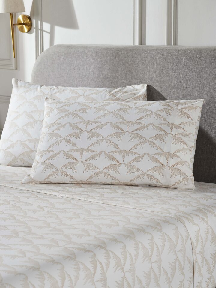 Close-up of Parvat beige textured cotton Sanganeri block printed queen bedsheet set (3 pcs) showing the fabric texture and block print details.