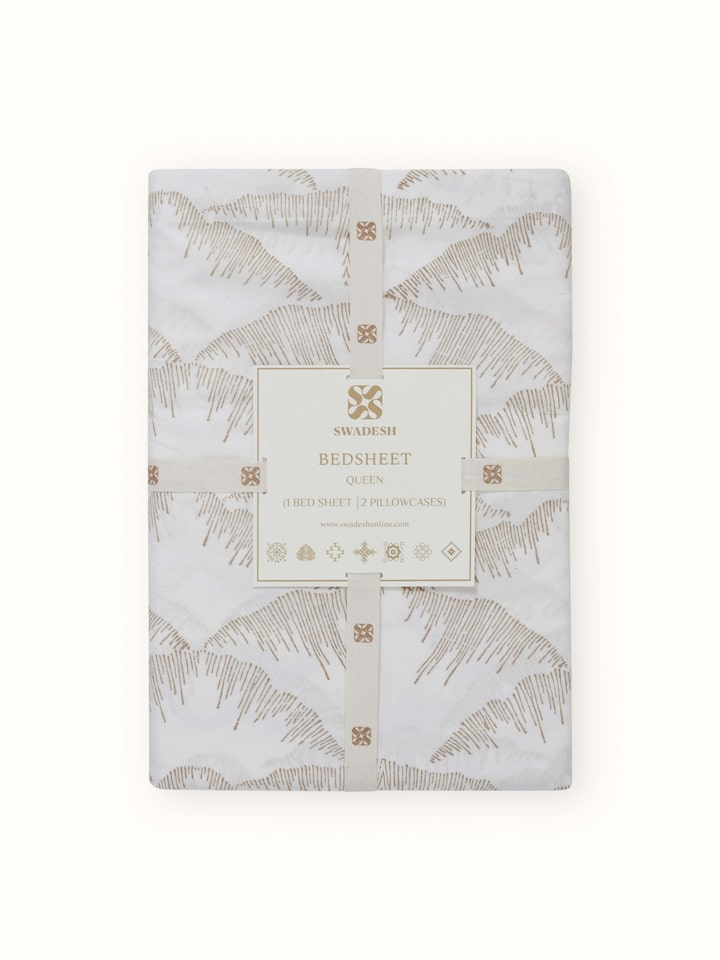 Parvat beige textured cotton Sanganeri block printed queen bedsheet set (3 pcs) folded to highlight the block print and texture.