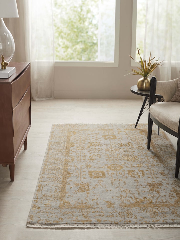 Close-up of Distressed Transitional Beige Agra Wool & Viscose Hand-Knotted Rug, highlighting the distressed pattern and fabric detail.