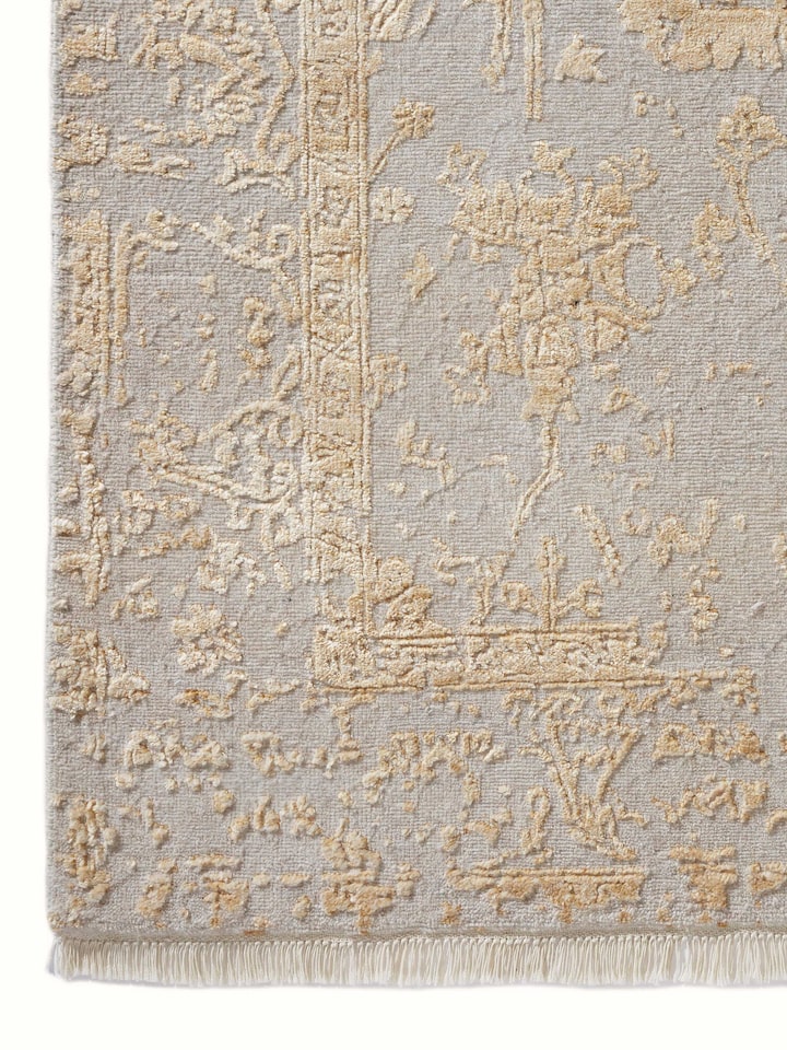Angled view of Distressed Transitional Beige Agra Wool & Viscose Hand-Knotted Rug, displaying the full distressed design and texture.