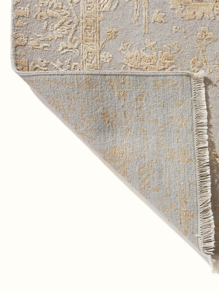 Full view of Distressed Transitional Beige Agra Wool & Viscose Hand-Knotted Rug, showing the rug in a styled interior setting.