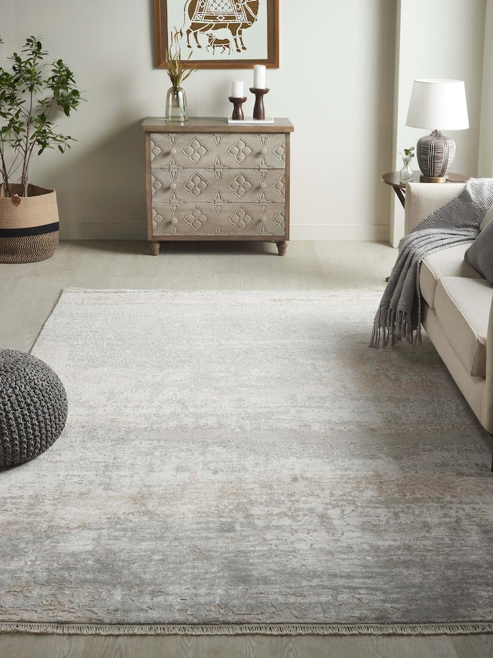 Grey beige abstract Agra wool and viscose rug styled in neutral-toned interior