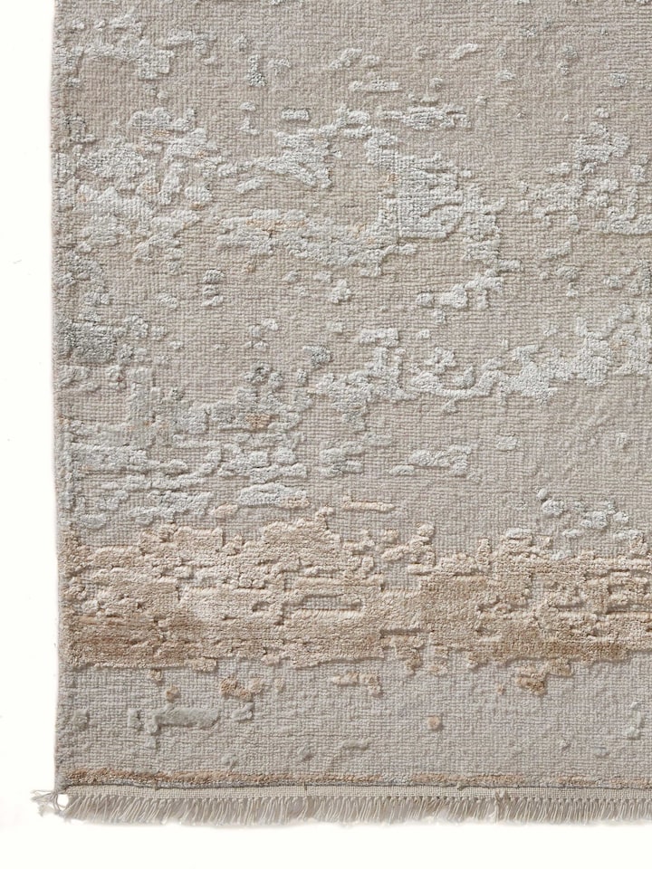 Detailed close-up of abstract grey beige hand-knotted Agra carpet design