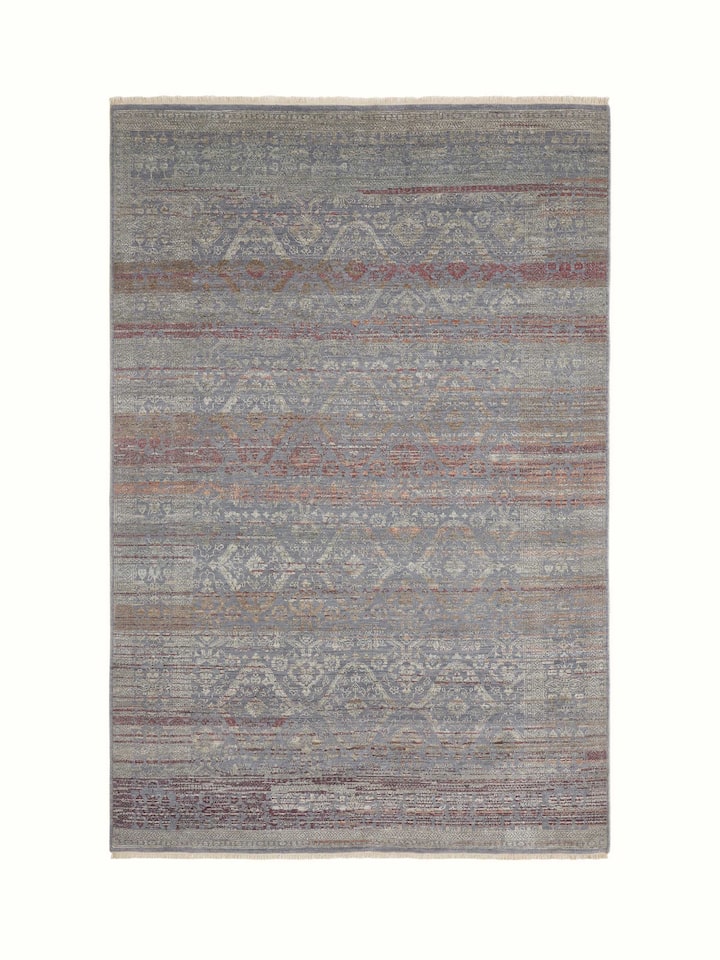 Full front view showcasing distressed grey-purple hand-knotted Agra carpet.