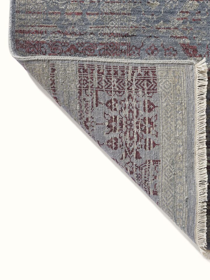 Rear side showing carpet backing and traditional hand-knot detailing.