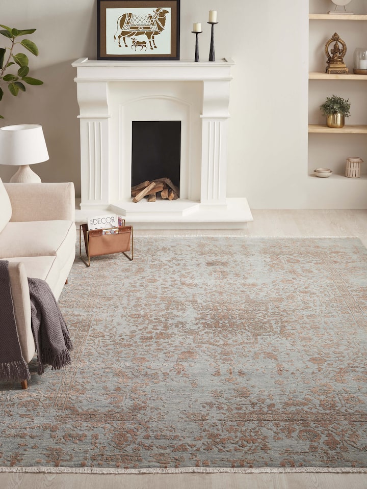 Styled view of Distressed Transitional Grey Copper Agra Wool & Viscose Hand-knotted Carpet styled in a room setting