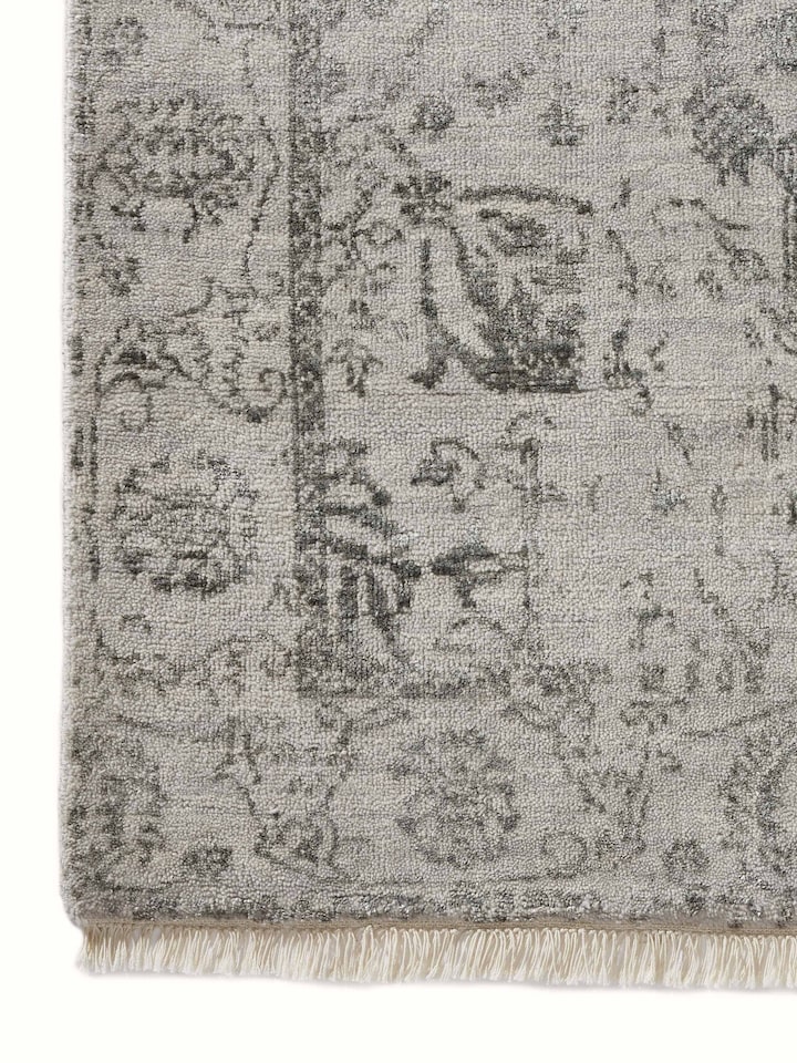 Distressed transitional grey charcoal Agra wool & viscose hand-knotted runner with focus on intricate pattern.