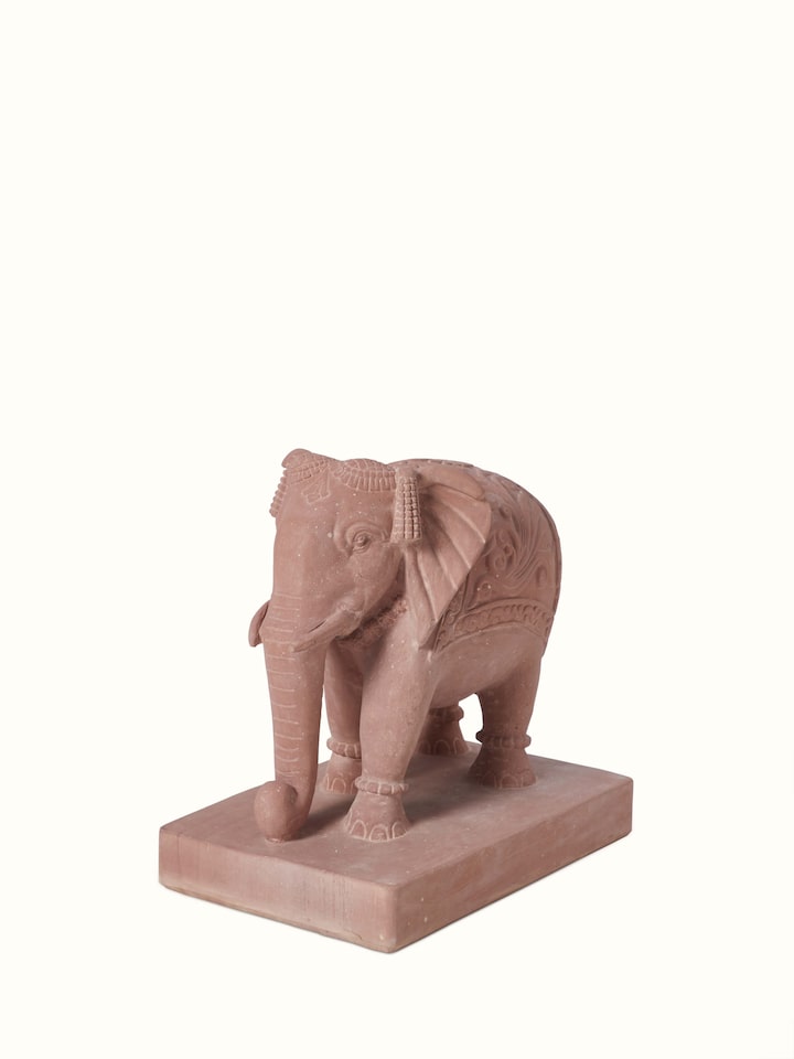 Side view of Hastin carved stone Gwalior elephant sculpture, showcasing the detailed carvings and artistic craftsmanship.