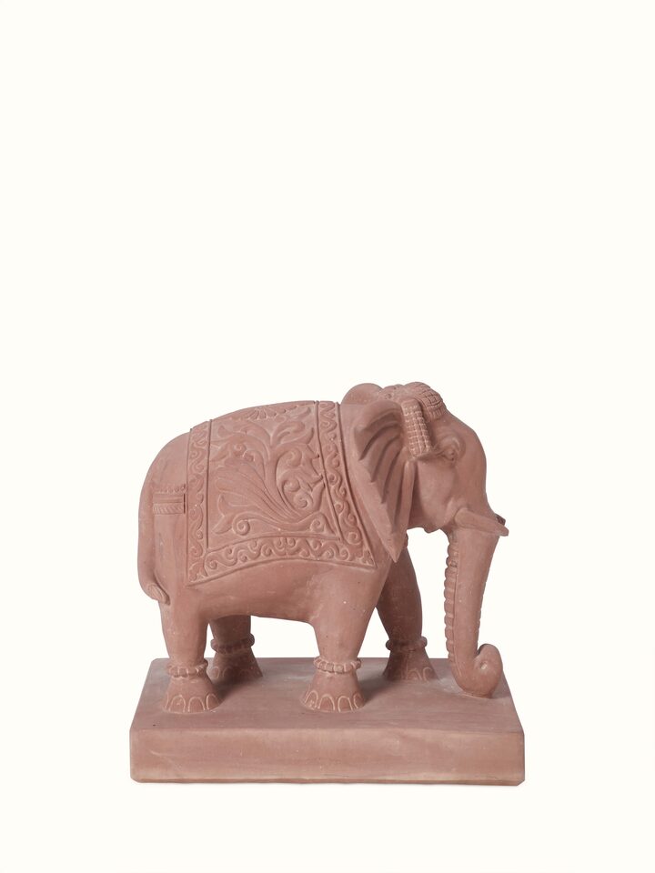 Close-up view of Hastin carved stone Gwalior elephant sculpture, focusing on the intricate details of the stone carving.