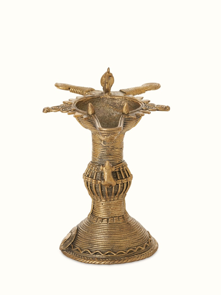 Front view of antique brass dhokra diya, showcasing its traditional design and intricate brass detailing