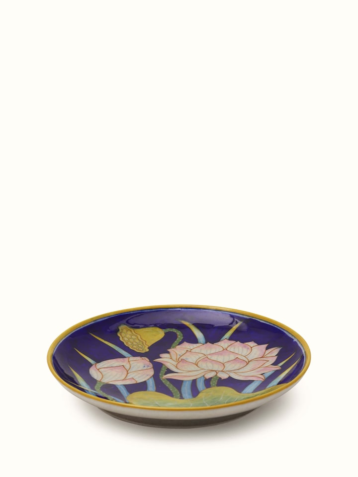 Angled view of Blue Pottery flower with leaf display plate emphasizing the detailed craftsmanship and design