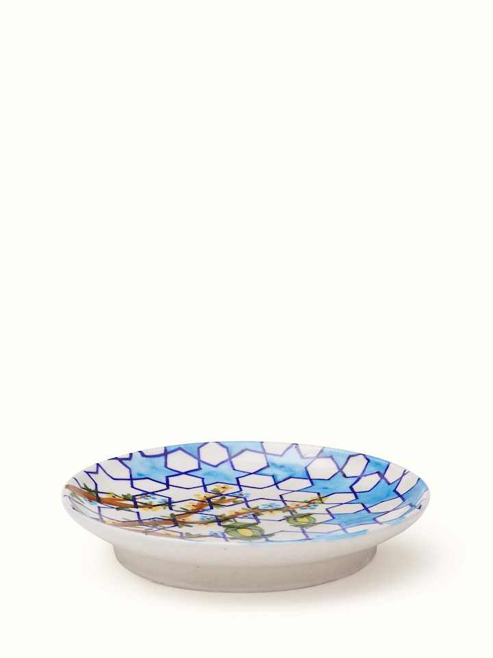 Side view of Blue Pottery Hexagonal Pattern Display Plate by Swadesh emphasizing the detailed craftsmanship and vibrant blue pattern.