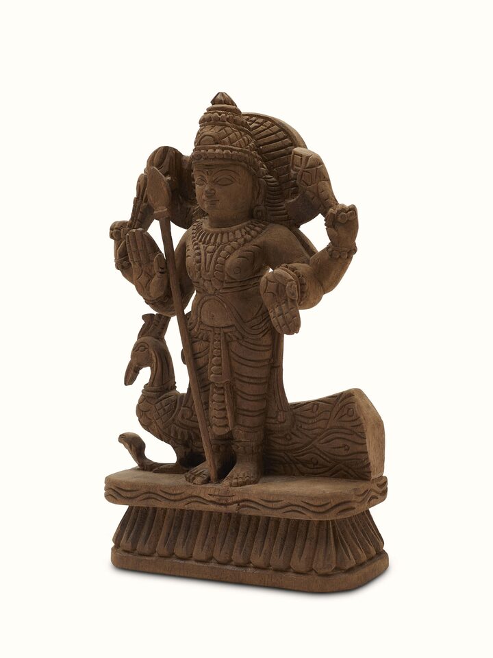 Angled view of Karthikeya carved neem wood swamy idol displaying the artistic design and intricate carvings