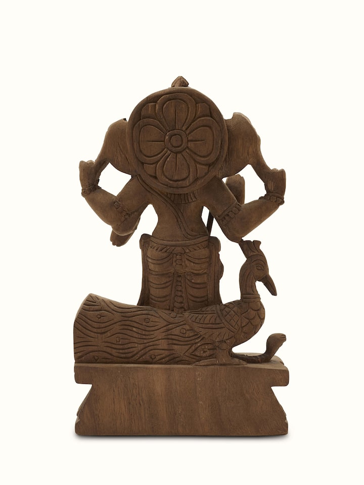 Detailed view of Karthikeya carved neem wood swamy idol focusing on the carved details and artistic features