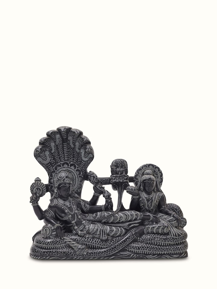 Front view of Carved stone Ananta Sayana idol, highlighting its intricate carvings and religious significance.