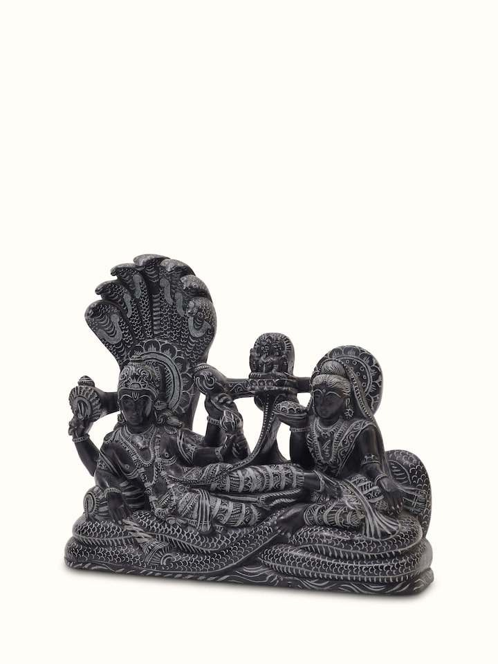 Close-up of Carved stone Ananta Sayana idol, focusing on fine details and artistic work.