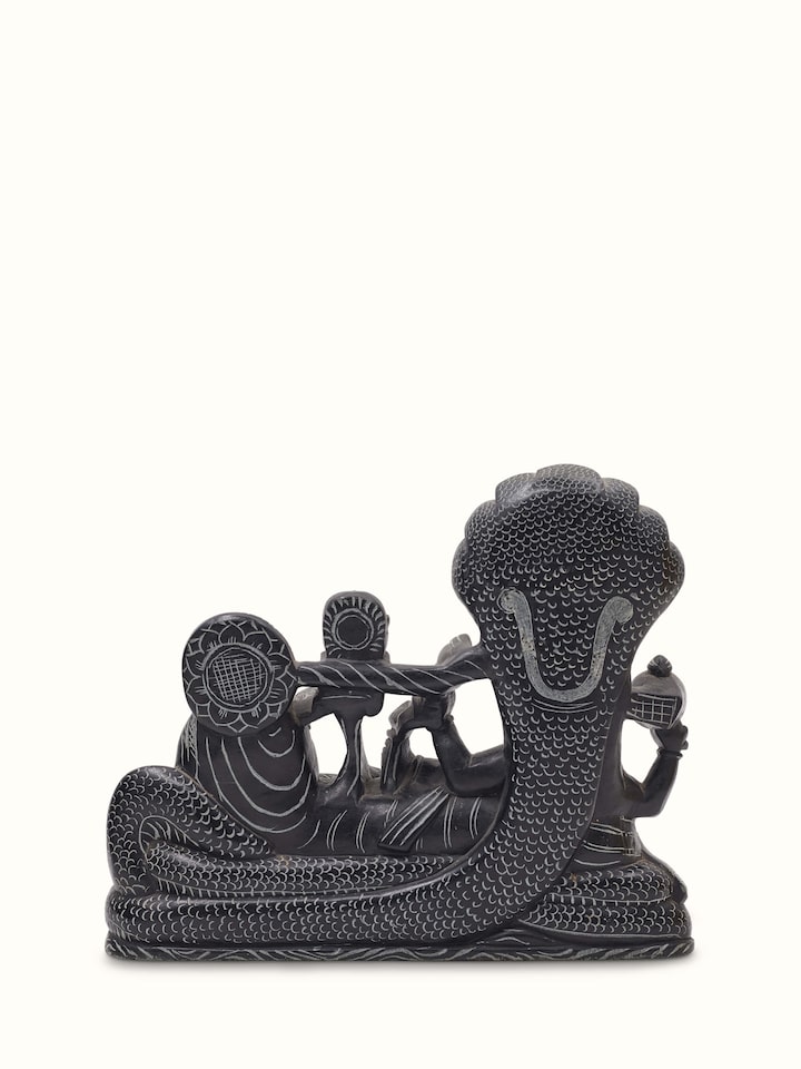Artistic view of Carved stone Ananta Sayana idol, showcasing its majestic appearance and design.