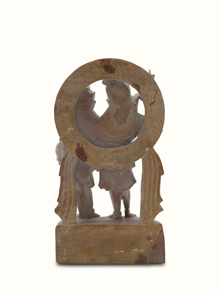 Detailed view of carved stone Shiva & Parvati idol, emphasizing the traditional and artistic stonework.