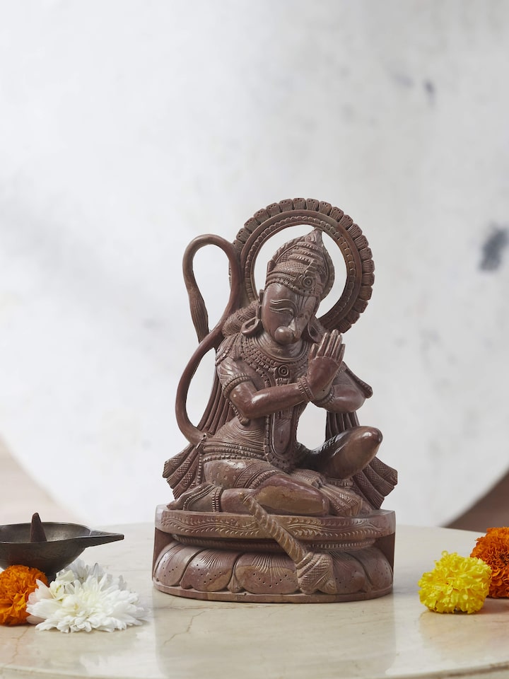 Side view of Carved Stone Hanuman Idol, highlighting the depth and texture of the carving