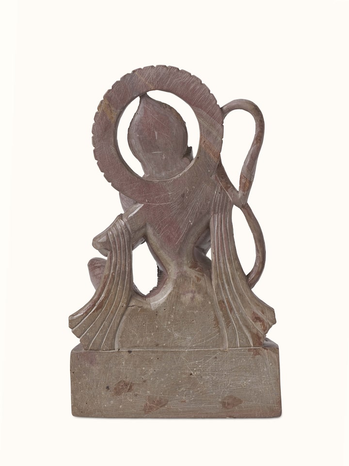 Side angle of Carved Stone Hanuman Idol, showing the texture and intricate carving on the surface